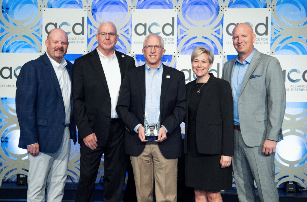 Group of five people at award ceremony.